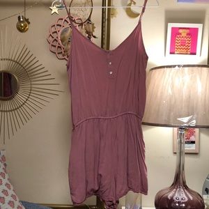 Forever 21 dark pink blush colored romper with pockets and lace detail on thigh